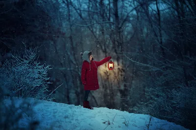 Child in Red Coat Holding Lantern in Snowy Forest - free wallpaper 6016×4016