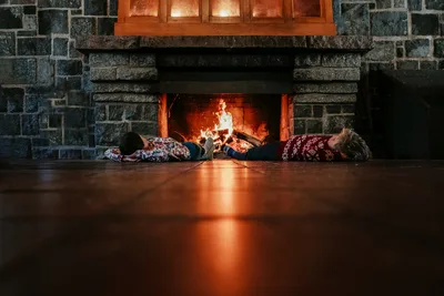Two People Lying Before a Fireplace - free wallpaper 6000×4000