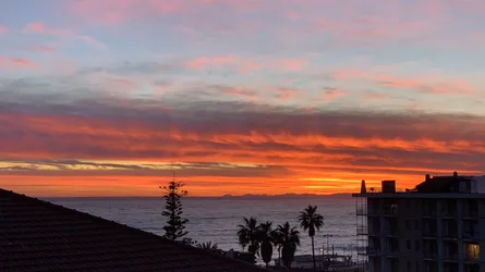 Dramatic Sunset Over Coastal Beach Town With Palm Trees - free wallpaper 4018×2260