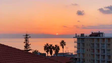 Coastal Sunset Over Mediterranean Beach Town - free wallpaper 4006×2253