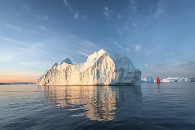 Massive Iceberg With Red Sailboat in Arctic Waters - free wallpaper 6144×4096