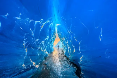 Ice Cave Tunnel with Person Standing in Blue Glacier - free wallpaper 6144×4096