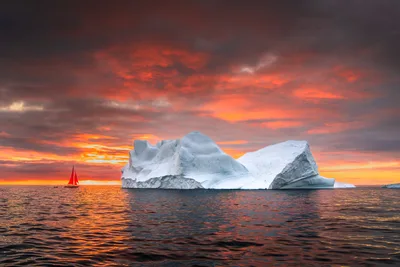 Red Sailboat and Iceberg at Sunset - free wallpaper 6144×4096