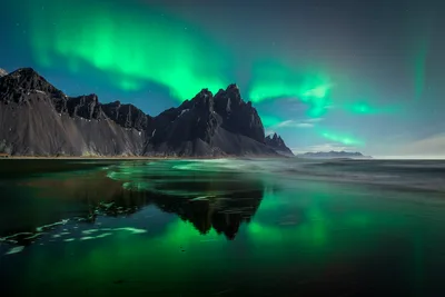 Northern Lights Over Coastal Mountain Cliffs - free wallpaper 6144×4096