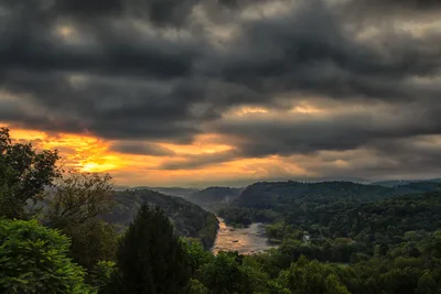 River Valley Sunset with Forested Mountains and Dramatic Clouds - free wallpaper 6192×4128