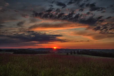 Sunset Over Rural Farmland with Dramatic Clouds - free wallpaper 7368×4924