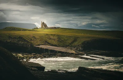 Coastal Castle on Green Cliffs Above Turbulent Seas - free landscapes wallpaper 5989×3886