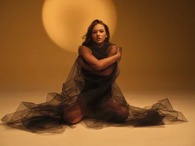 Woman in Sheer Fabric Against Warm Golden Backdrop - free people & portraits wallpaper 11648×8736