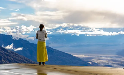 Woman in Yellow Skirt Overlooking Mountain Valley - free people & portraits wallpaper 5730×3465
