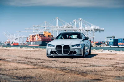 White BMW M4 at Industrial Port Terminal - free wallpaper 6720×4480
