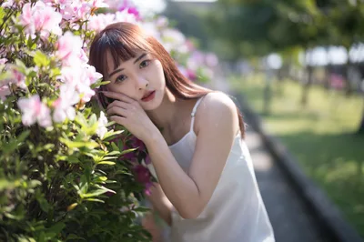 Woman in White Dress Among Pink Flowering Shrubs - free wallpaper 4000×2658
