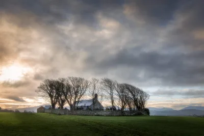 Ancient Church Among Bare Trees in Rural Landscape - free wallpaper 6240×4160