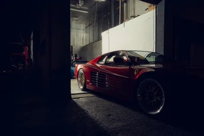 Red Ferrari in Industrial Garage Setting - free cars & vehicles wallpaper 2048×1365