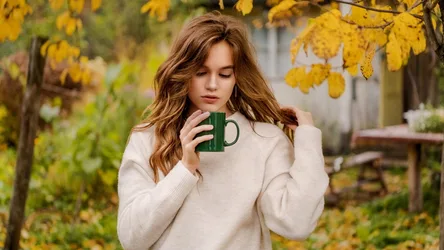 Girl in Cream Sweater Holding Green Mug in Autumn Garden - free people & portraits wallpaper 2048×1152