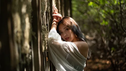 Woman in White Shirt Against Moss-Covered Stone Wall - free people & portraits wallpaper 2047×1151