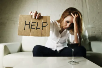 Woman Holding Help Sign While Sitting with Wine Glass - free people & portraits wallpaper 4645×3092