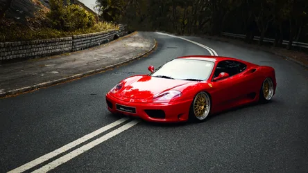 Red Ferrari Sports Car On Curved Mountain Road - free cars & vehicles wallpaper 1920×1080