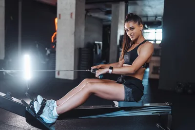 Woman Using Rowing Machine in Modern Gym - free people & portraits wallpaper 6000×4000