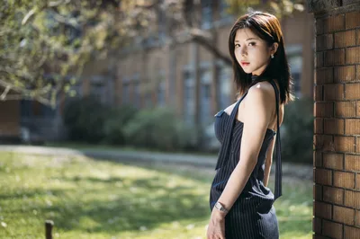 Woman in Black Pinstripe Dress by Brick Wall - free people & portraits wallpaper 4000×2658
