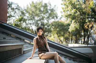 Woman Posing on Modern Urban Staircase in Sunlight - free people & portraits wallpaper 4000×2658