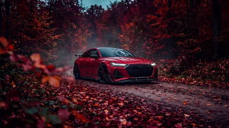 Red Sports Car in Autumn Forest Path - free cars & vehicles wallpaper 5504×3072