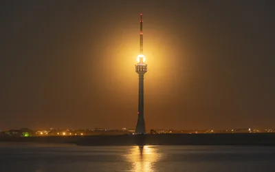 Illuminated Tower Reflected in Water at Night - free landscapes wallpaper 3600×2250