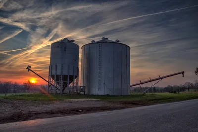 Farm Grain Silos at Sunset with Auger - free wallpaper 7368×4924