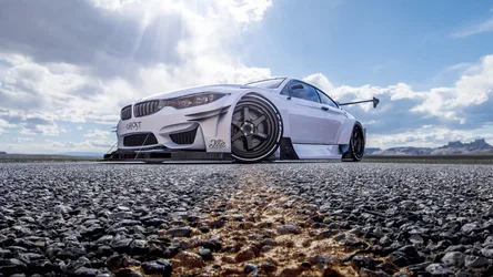 White BMW M4 Race Car on Rocky Desert Landscape - free cars & vehicles wallpaper 1920×1080
