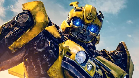 Yellow and Black Robot with Glowing Blue Eyes - free movies & tv wallpaper 1920×1080