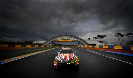 BMW Race Car at Le Mans Circuit Under Storm Clouds - free cars & vehicles wallpaper 4112×2412