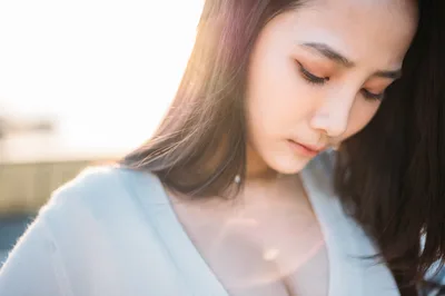 Woman in Light Blue Shirt Gazing Downward - free people & portraits wallpaper 4000×2657