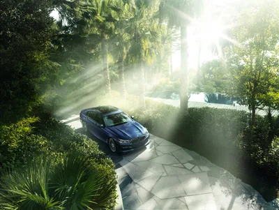 Luxury Sedan Parked in Tropical Garden Driveway - free cars & vehicles wallpaper 4096×3078