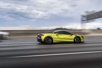 Bright Yellow Sports Car Speeding on Highway - free cars & vehicles wallpaper 9504×6336