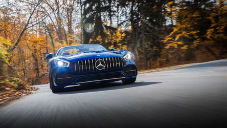 Blue Mercedes-AMG Sports Car on Autumn Road - free wallpaper 4096×2304