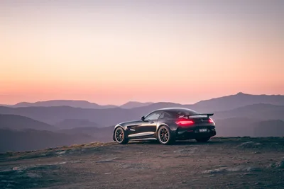 Black Sports Car at Sunset in Mountain Landscape - free wallpaper 4134×2756