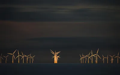 Wind Turbines Silhouetted Against Dark Sky at Dusk - free photography wallpaper 6144×3854