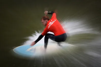 Surfer in Red O'Neill Jacket Riding Wave with Motion Blur - free photography wallpaper 6144×4077