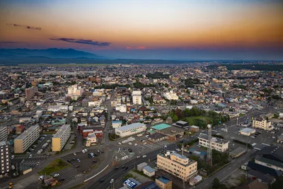 Sunset Over Japanese City Valley With Mountains - free city & urban wallpaper 7680×5120
