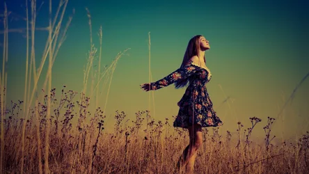 Woman in Floral Dress Standing in Dry Field at Sunset - free wallpaper 1920×1080
