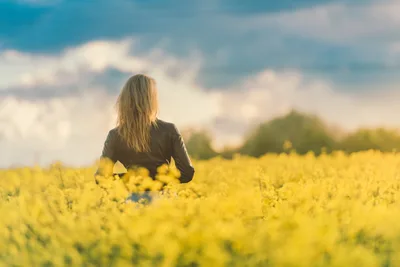 Woman Running Through Yellow Flower Field - free wallpaper 3371×2250