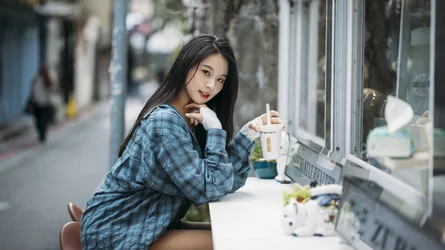 Woman in Plaid Shirt Holding Beverage by Store Window - free people & portraits wallpaper 4000×2248
