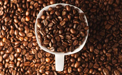White Coffee Cup Filled With Roasted Coffee Beans - free wallpaper 5826×3570