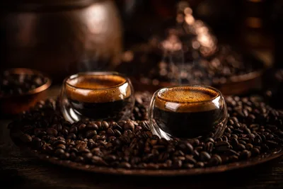 Two Espresso Shots with Coffee Beans and Warm Lighting - free food wallpaper 2000×1333