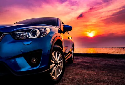 Blue Car at Sunset by the Sea - free cars & vehicles wallpaper 2400×1627