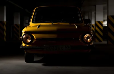 Yellow Vintage Car in Underground Parking Garage - free cars & vehicles wallpaper 2557×1658