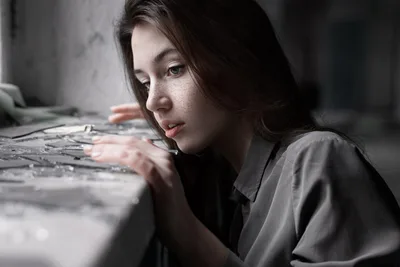 Woman Examining Architectural Plans at Table - free wallpaper 2160×1441