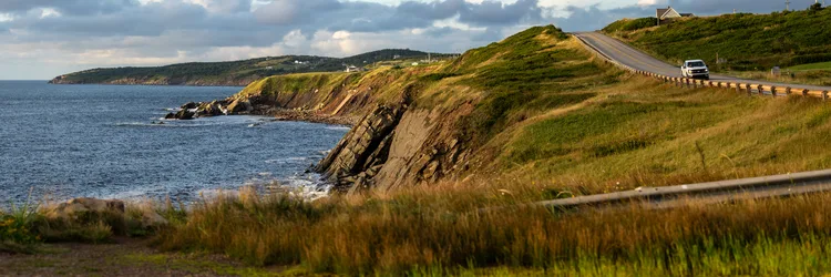 Coastal Cliffs and Highland Road - free landscapes wallpaper 7680×2560