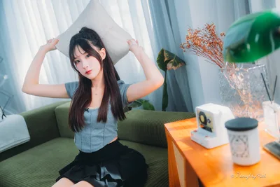 Young Woman Posing With Pillow in Modern Interior - free wallpaper 6144×4096