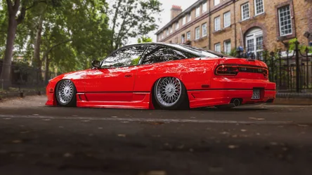Vibrant Red Sports Car Parked on Urban Street - free cars & vehicles wallpaper 1920×1080