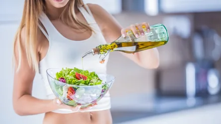 Woman Drizzling Olive Oil Over Fresh Salad Bowl - free people & portraits wallpaper 7680×4319